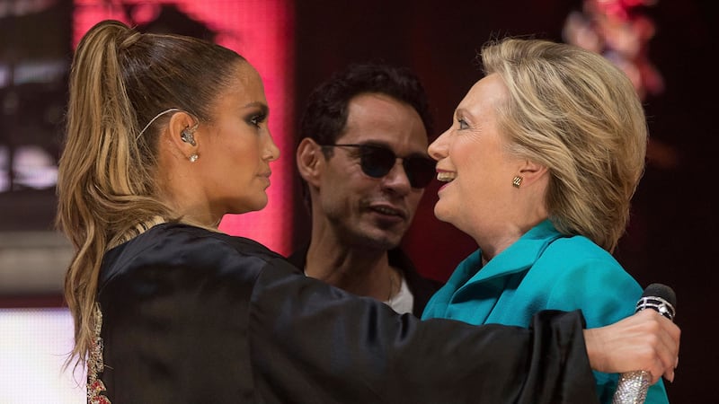 Defeated Democratic presidential candidate Hillary Clinton, right, accompanied by singer-songwriter Marc Anthony, centre, hugs performer Jennifer Lopez, left, at a Get Out The Vote performance at Bayfront Park Amphitheater in Miami prior to the US election. Picture by Andrew Harnik, Associated Press&nbsp;