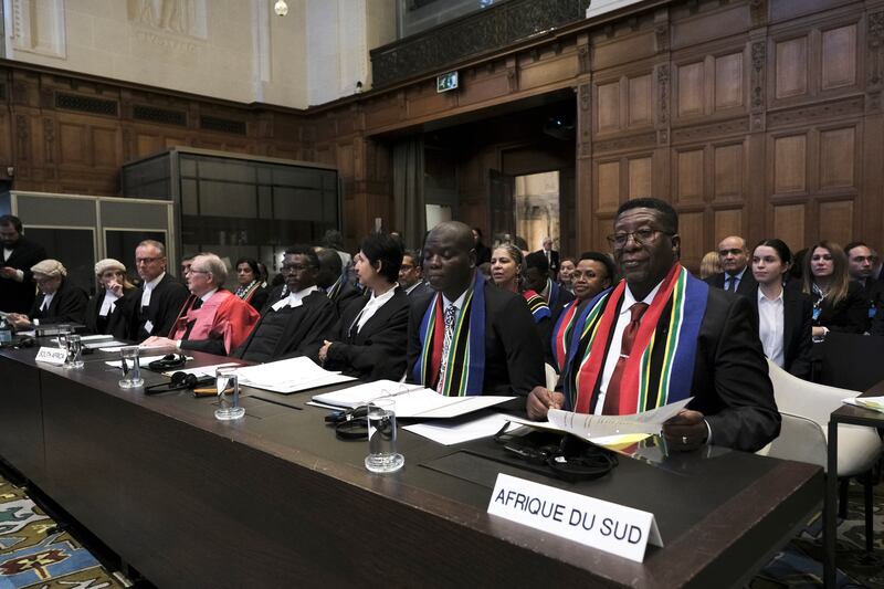 Ambassador of the Republic of South Africa to the Netherlands Vusimuzi Madonsela, right, and minister of justice and correctional services of South Africa Ronald Lamola, centre, at the International Court of Justice (Patrick Post/AP)