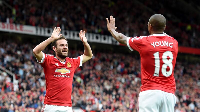 Juan&nbsp;Mata&nbsp;celebrates scoring Manchester United's third goal of the game against Sunderland with team-mate Ashley Young (right)&nbsp;