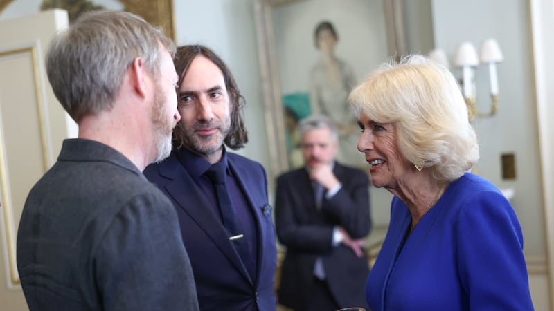 Queen Camilla speaks to author Paul Murray (left) and Paul Lynch (centre). (Chris Jackson/PA)