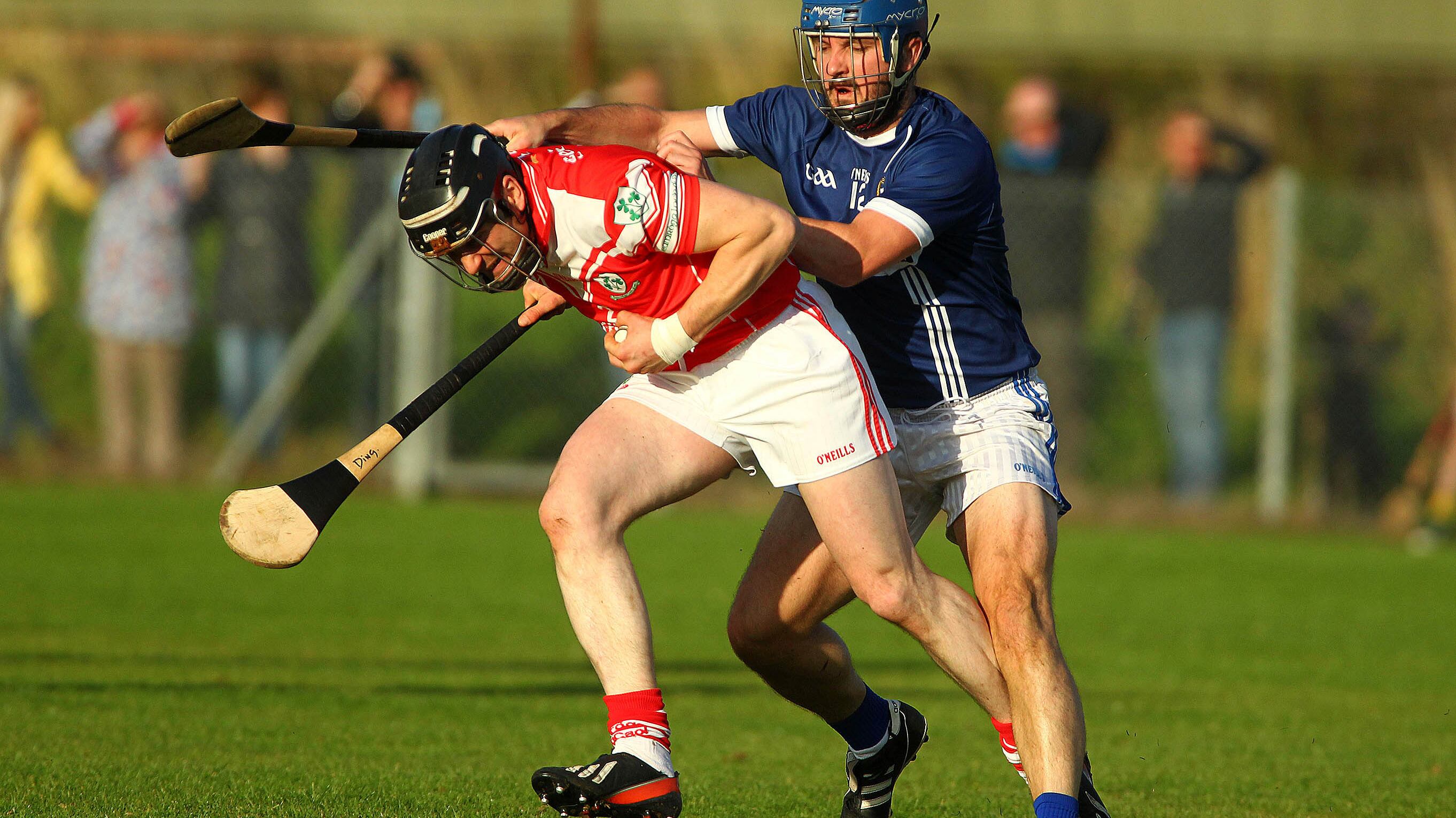 Loughgiel's Paul Gillan is challenged by St Gall's Seán McAreavey during Saturday night's Antrim Championship quarter-final at Corrigan Park <br />Picture: Séamus Loughran 