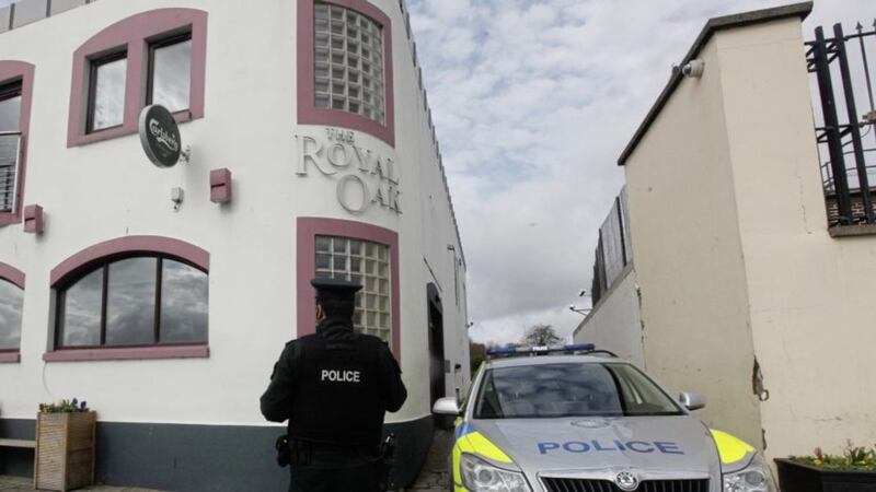 Police at the scene of the Royal Oak Bar in Carrickfergus after a barman suffered serious head injuries. Picture by Ann McManus. 
