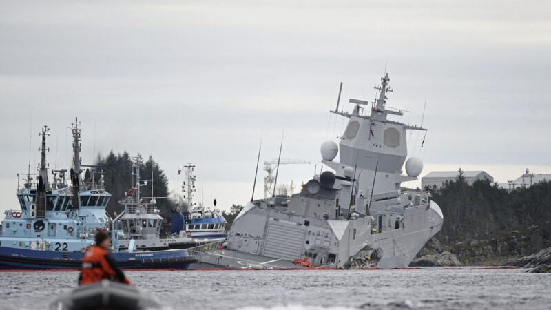 The KNM Helge Ingstad, right, after a collision with the tanker Sola TS, in Oygarden, Norway on Thursday PICTURE: Hommedal/NTB Scanpix via AP 
