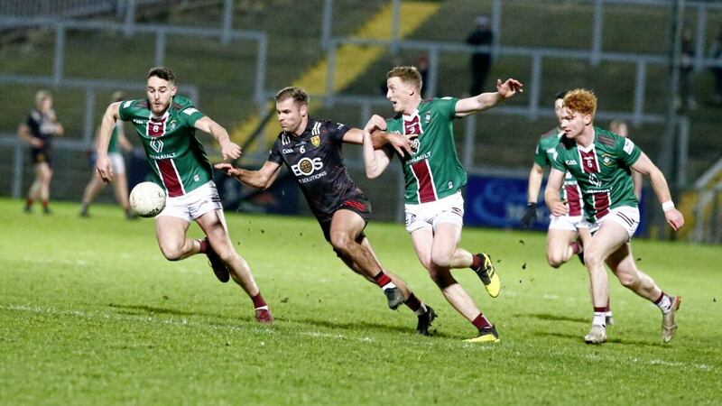 Down&#39;s Gerard Collins has Westmeath&#39;s Sam Duncan and Ray Connellan for company during Saturday night&#39;s Division Three clash in Newry. Picture by Philip Walsh 
