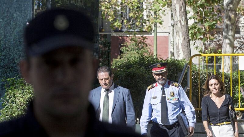 Catalan regional police chief Josep Luis Trapero, third left, arrives at the national court in Madrid PICTURE: Paul White/AP 