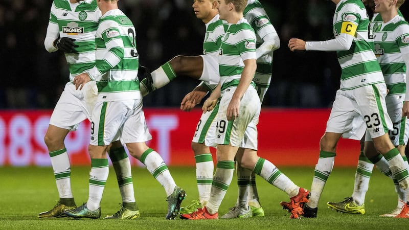 A BITT OF CLASS: Celtic&rsquo;s Nir Bitton (left) celebrates scoring his side&rsquo;s fourth goal of the game with team-mates during yesterday&rsquo;s 4-1 win over Ross County in the Ladbrokes Premiership clash at the Global Energy Stadium, Dingwall &nbsp;<span class="Apple-tab-span" style="white-space: pre;">	</span>