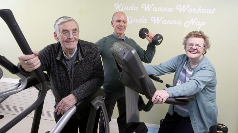 Joe Gillen (81) and Marie Smyth (74) try out some the gym equipment with sports coach Mick McGurn at the new &pound;1.6m Cupar Street facility for older people in west Belfast. Picture by Mal McCann