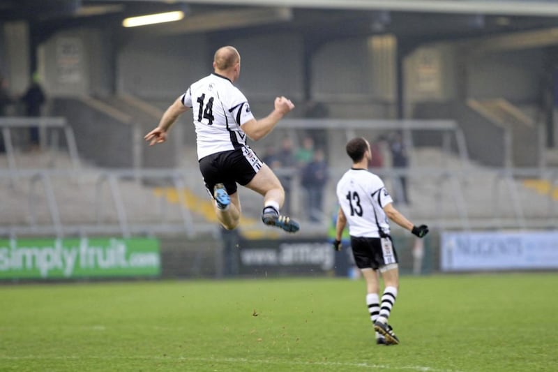 Anthony Devlin jumps for joy in the moments after Kilcoo won the Down championship in 2009. Picture by Philip Walsh 