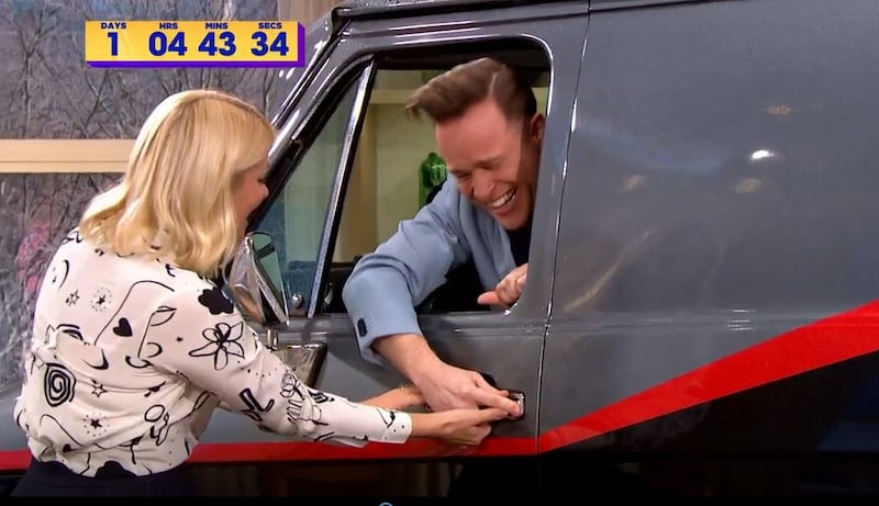 Screengrab of Olly Murs and Holly Willoughby on This Morning (PA)