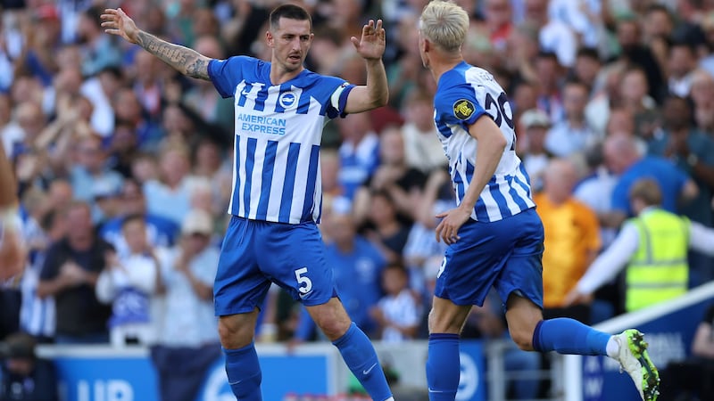 Lewis Dunk earned Brighton a point with a late equaliser against Liverpool (Steven Paston/PA)