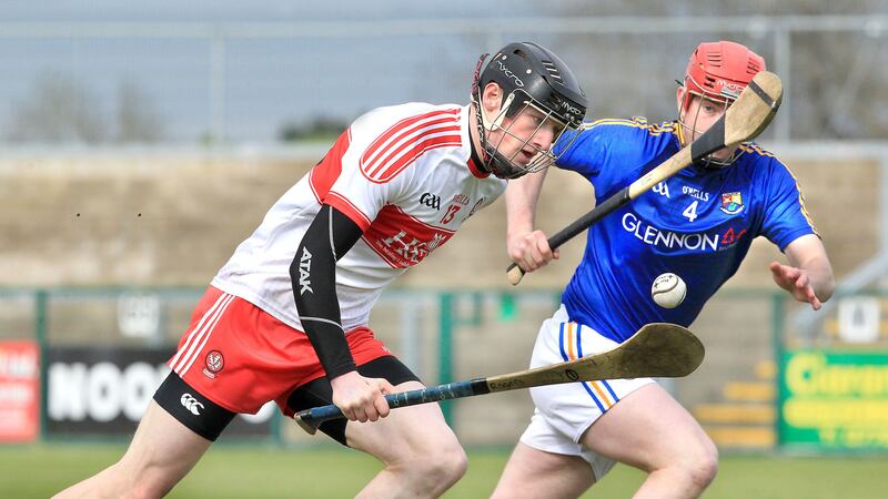 Derry's Brendan Rogers with Thomas Egan of Longford during the Nicky Rackard Cup match at Owenbeg on Saturday. Picture by Margaret McLaughlin&nbsp;