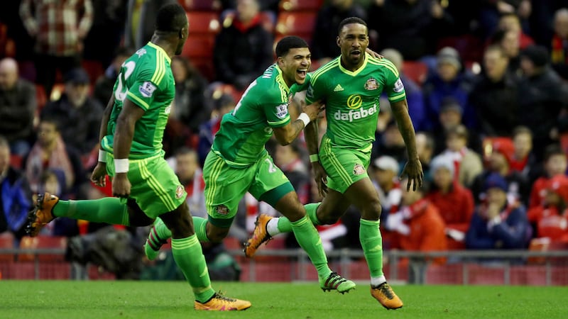 Sunderland's DeAndre Yedlin (centre) and Lamine Kone (left) celebrate with Jermain Defoe after he scored a late equaliser against Liverpool at Anfield on Saturday<br />Picture by PA&nbsp;