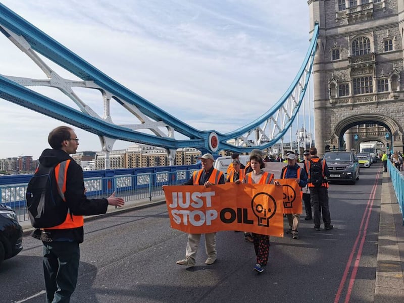 Activists stage a slow walk protest in central London