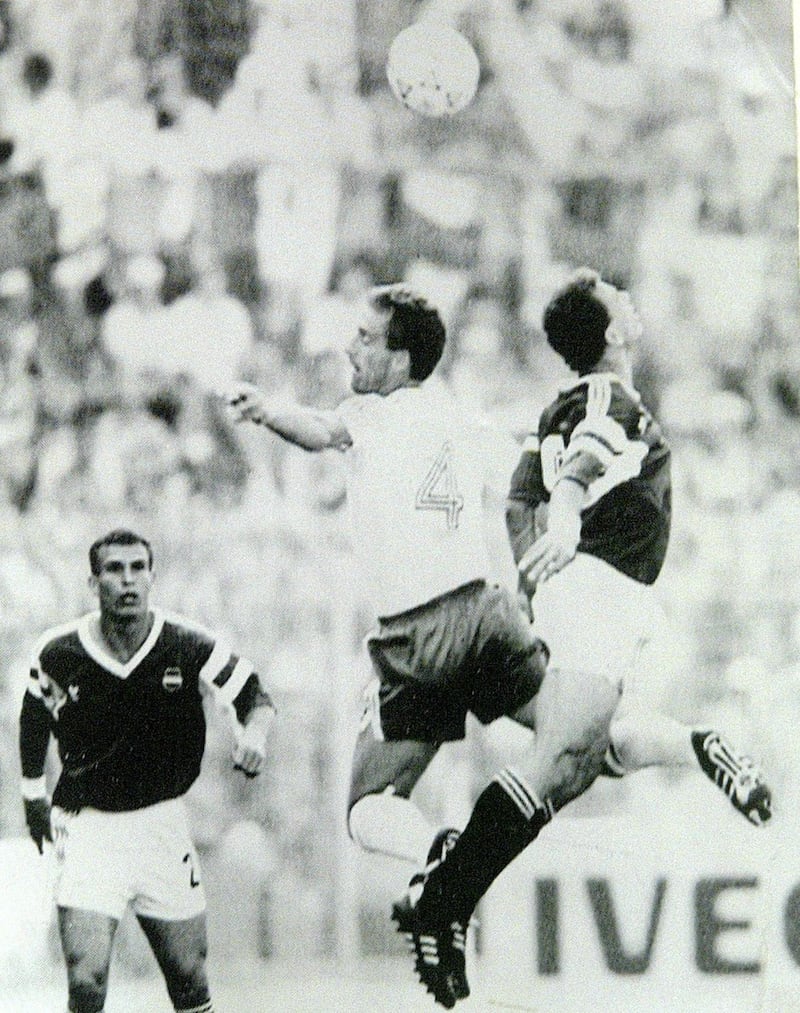 Mick McCarthy in action against Egypt's Hossam Hassan in the group stages of Italia 90