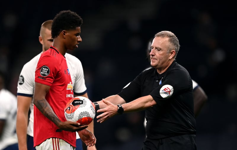 &nbsp;Referee Jonathan Moss takes the ball from Manchester United's Marcus Rashford as he prepares to take the second penalty they are awarded before it was overturned by VAR during the Premier League match at the Tottenham Hotspur Stadium, London.