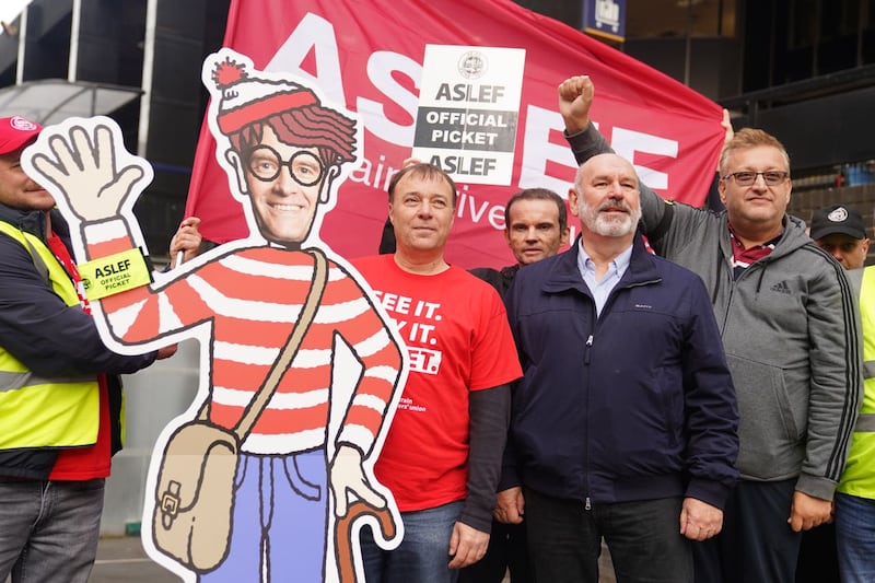 Aslef general secretary Mick Whelan (second right) on a picket line at Euston station in London