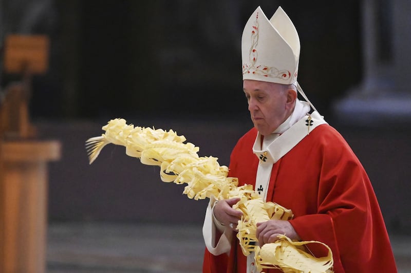 &nbsp;Pope Francis holds a palm branch as he celebrates Palm Sunday Mass. Picture by AP Photo/pool/Alberto Pizzoli