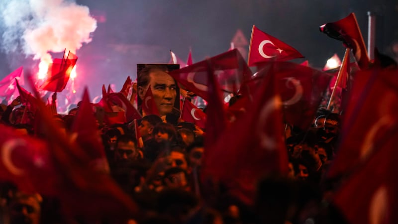 Supporters of Istanbul Mayor and Republican People’s Party candidate Ekrem Imamoglu celebrate outside the City Hall in Istanbul (Khalil Hamra/AP)