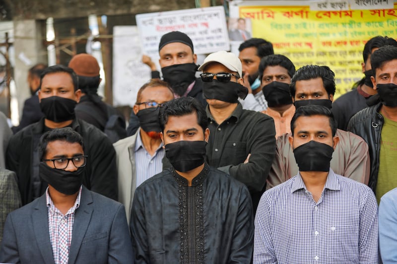 Activists of Gono Odhikar Parishad protest against what they called a one-sided election at the National Press Club in Dhaka (AP)
