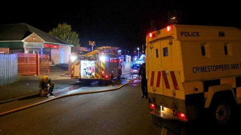 Police and firefighters attend the scene in Twinbrook on Saturday night where over 200 youths set fire to a former bar and rioted Picture by Kevin Scott /Presseye 