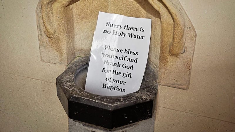 The winning photograph showing a message placed in an empty holy water font in a church 