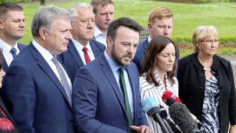 SDLP leader Colum Eastwood and party colleagues speak to the media at Stormont Castle. Picture by Mal McCann