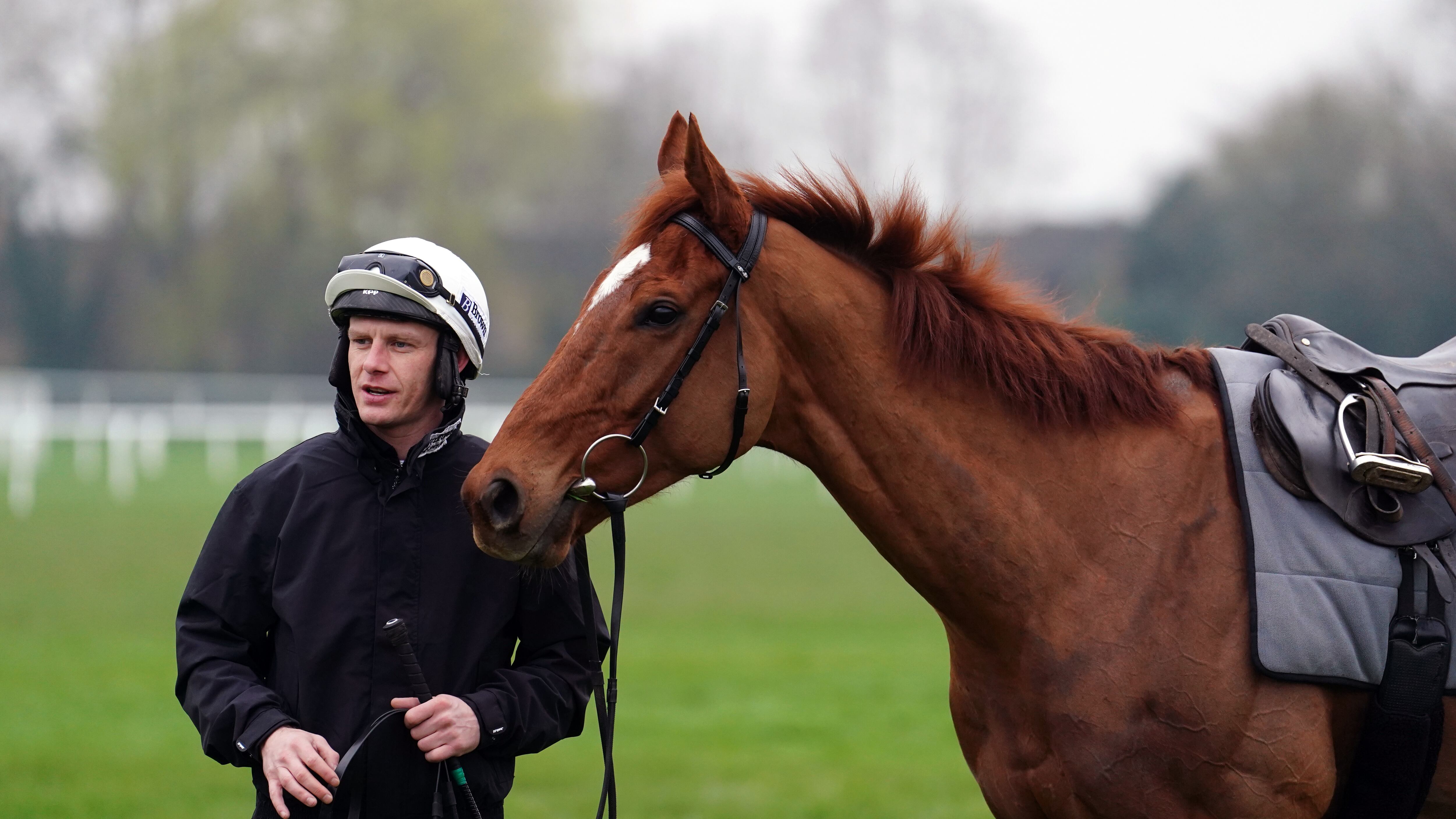Paul Townend with State Man on the gallops at Cheltenham Racecourse, ahead of the 2024 Cheltenham Festival, which begins tomorrow. Picture date: Monday March 11, 2024.
