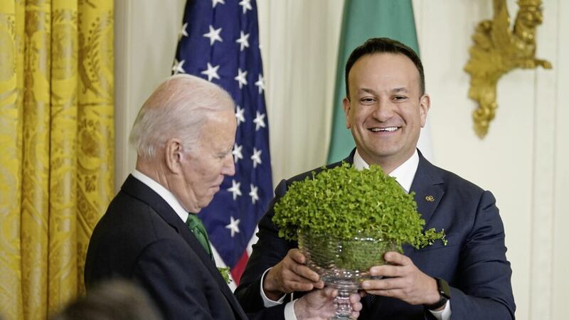 Taoiseach Leo Varadkar presents US President Joe Biden with a bowl of shamrock at the White House on St Patrick&#39;s Day 