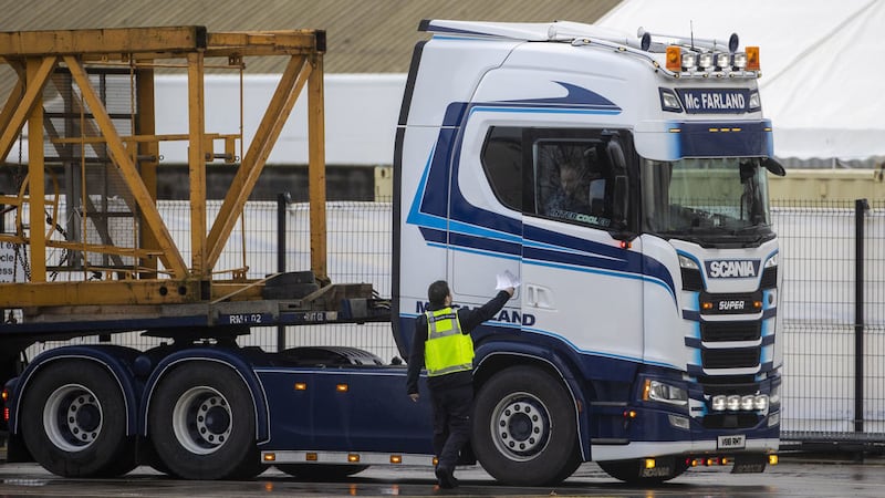 A UK Border Force officer handing back paperwork to a lorry driver at the NI Department of Agriculture, Environment and Rural Affairs (DAERA) Northern Ireland Point of Entry (POE) site on Milewater Road in Belfast at the Port of Belfast. Picture by Liam McBurney/PA Wire&nbsp;