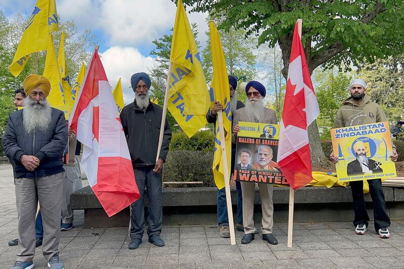 Members of British Columbia’s Sikh community gather in front of the courthouse in Surrey, British Columbia (Chuck Chiang/AP)