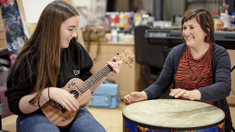 Katy Fyfe harmonises with Michelle Wooderson, Cancer Focus NI music therapist 