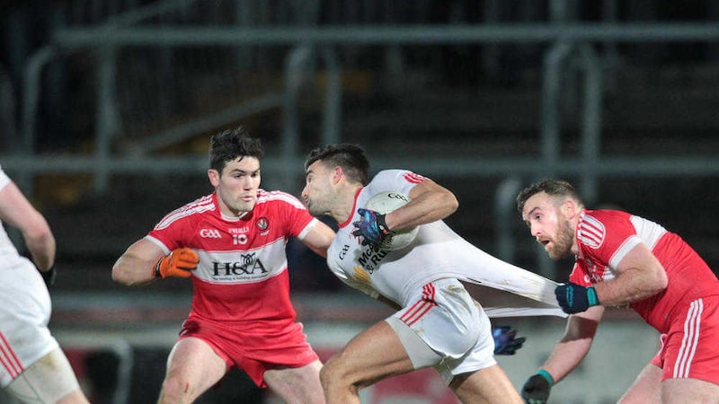Tyrone's Tiernan McCann with Daniel Heavron and Emmett McGuckin of Derry during the National League match at Healy Park last Saturday night<br />Picture by Margaret McLaughlin