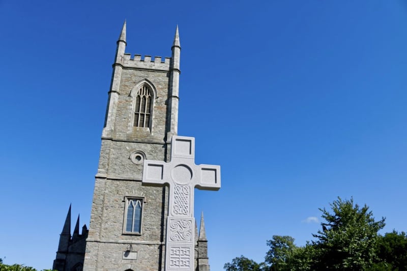 St Patrick&#39;s Cross stands on the Hill of Down in front of Down Cathedral in Downpatrick 