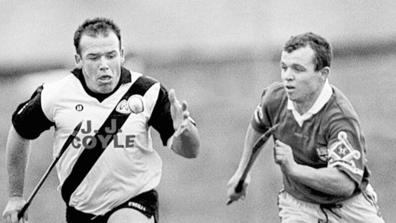 UNDER CONTROL...Dungiven&rsquo;s John A Mullan takes possession of the sliothar with Ballygalget&rsquo;s Liam Clarke in hot pursuit during the 1998 Ulster Club Hurling semi-final at Corrigan Park