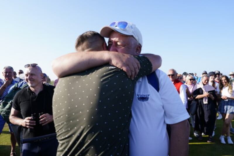 Alex Maguire and his father, Sean, embrace after his East of Ireland win this year                          Picture: Fran Caffrey/Golffile.