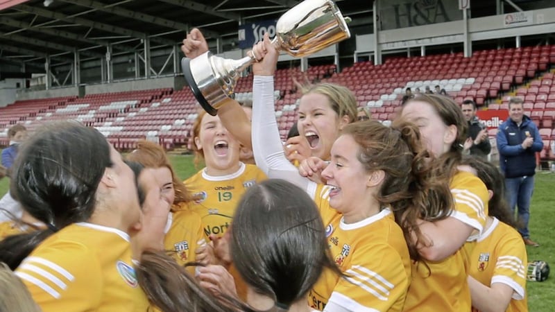 Antrim minor captain Cassie McArthur raises the cup with the team after beating Derry in the Ulster Camogie Minor Final at Celtic Park Derry on Sunday Picture: Margaret McLaughlin. 