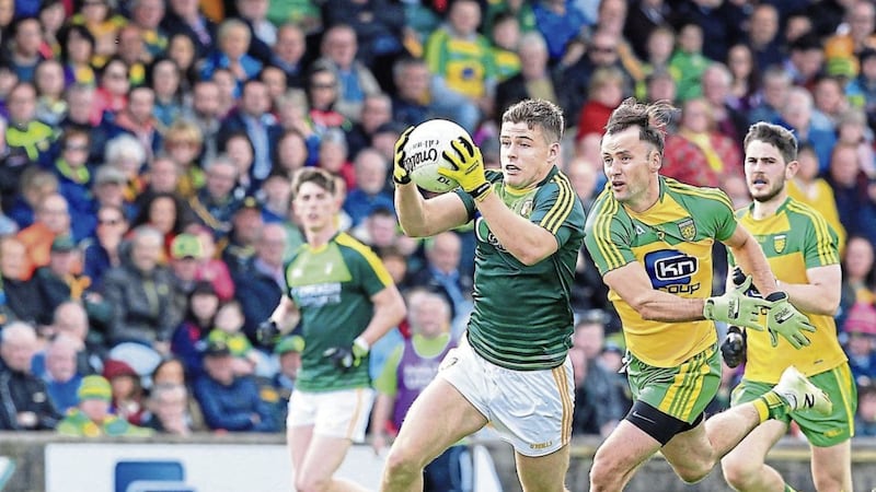 Donegal&#39;s Karl Lacey moves in on Declan Lynch of Antrim during the Ulster Senior Football Championship quarter-final match at Ballybofey 