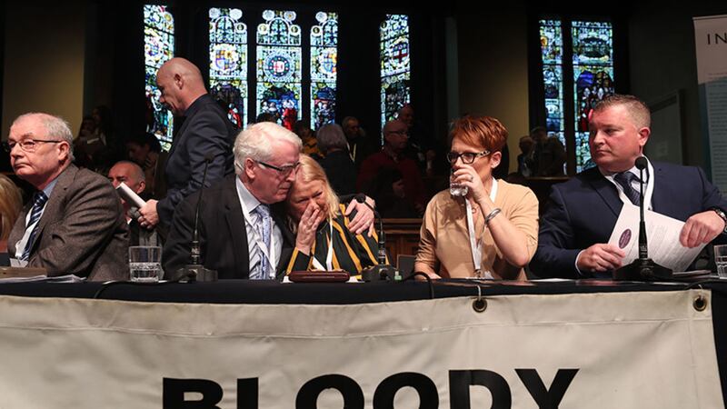 John Kelly comforts Alana Burke who was injured on Bloody Sunday reacts during the press conference at the Guildhall in Derry after the announcement from the Public Prosecution Service that one former paratrooper, soldier F is to be charged with two murders and four attempted murders during Bloody Sunday in 1972&nbsp;