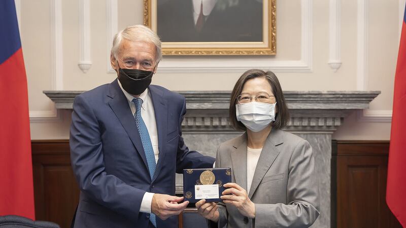 Taiwan's President Tsai Ing-wen exchanges gift with US Democrat Sen Ed Markey of Massachusetts during a meeting at the Presidential Office in Taipei, Taiwan on Monday, Aug. 15, 2022 (Taiwan Presidential Office via AP)