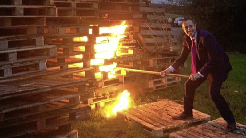 The DUP&#39;s Paul Givan lighting an Eleventh Night bonfire last year as communities minister 