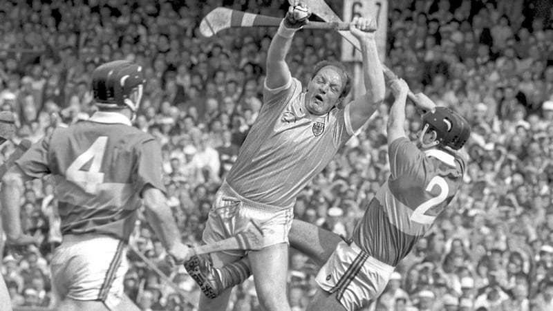 Terence McNaughton of Antrim rises to snatch the sliotar ahead of two Tipperary players in the 1989 All Ireland senior hurling final 