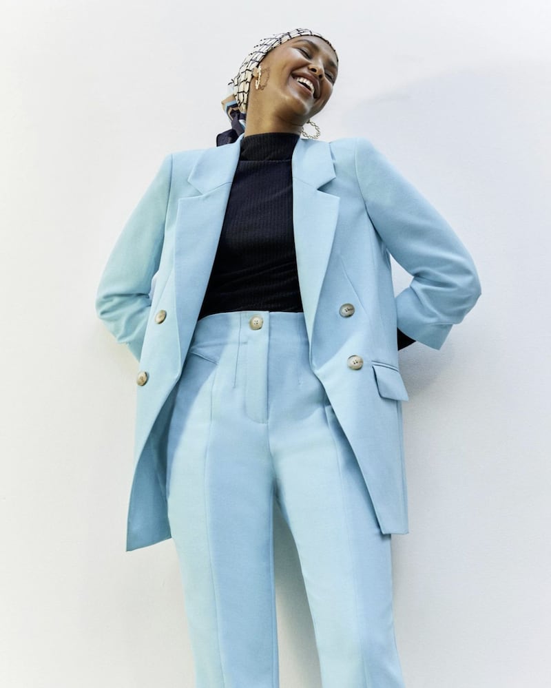 Blue Longline Ruched Sleeve Soft Blazer, &pound;60; Blue split front cigarette leg trousers, &pound;36; Black Long Sleeve High Neck Ribbed Top, &pound;14, available from River Island 