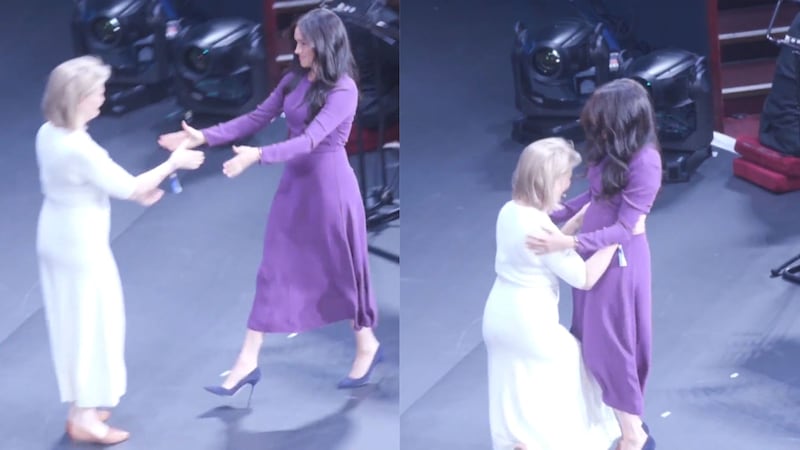 The Duchess of Sussex and Kate Robertson shared an awkward greeting at the opening ceremony of the summit.