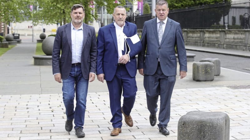 Malachy McAllister (centre) at Belfast High Court with Mark Thompson RFJ (left) and solicitor Niall Murphy. Picture by Hugh Russell. 
