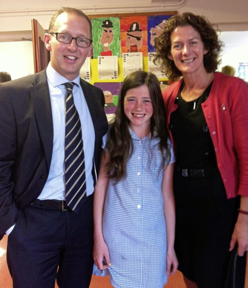 Schoolgirl Olivia Neill and her parents Graeme and Paula  