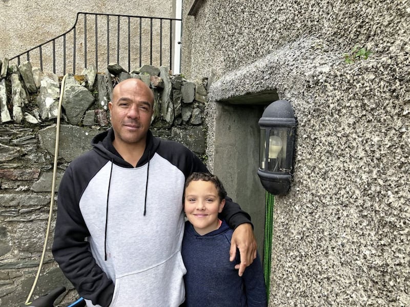 Dave Williams, who lives in Strangford and who is pictured with his son, was among those who jumped in the water to help rescue the trapped driver 