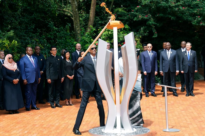 Rwandan President Paul Kagame lights a memorial flame at the Kigali Genocide Memorial (Brian Inganga/AP)