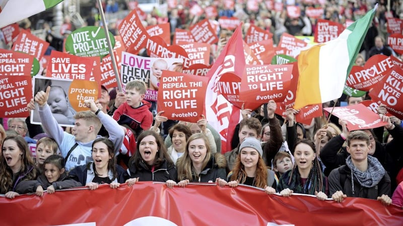 Anti-abortion protesters march through Dublin to campaign for the Eighth Amendment of the constitution to be retained in this summer&#39;s referendum. Picture by Caroline Quinn/PA 