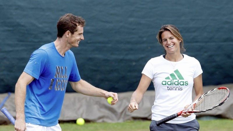 Andy Murray takes part in a practice session with his coach Amelie Mauresmo in 2014. 