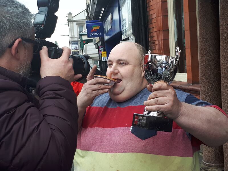 Ian Gerrard poses with the trophy at the 2019 World Pie Eating Championships